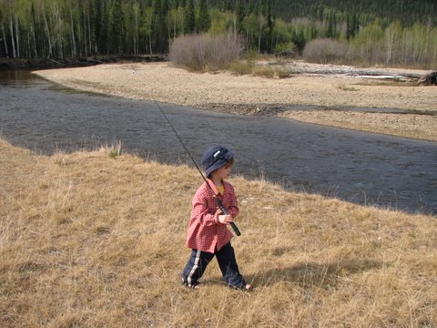 This young angler is heading out for some Arctic grayling.